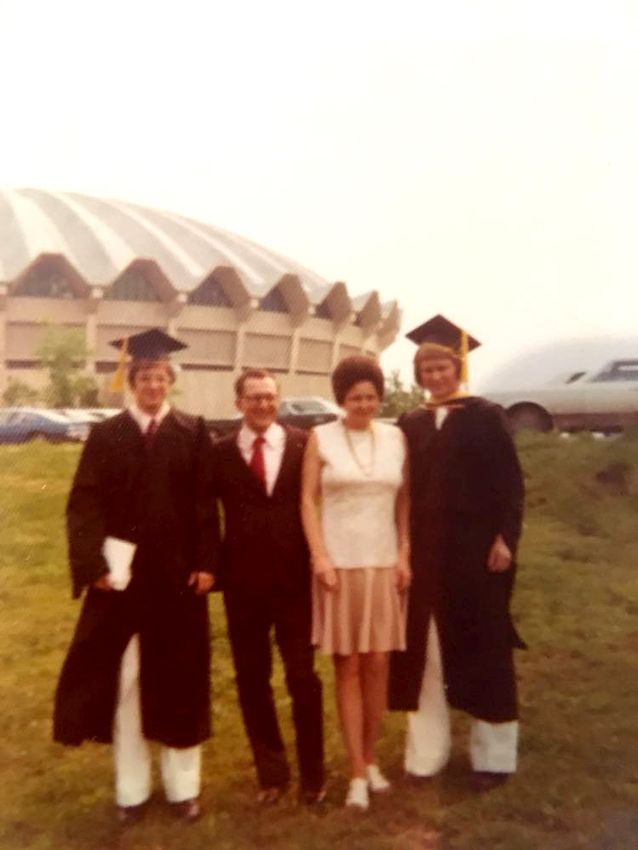 Totterdale brothers with their parents outside the Coliseum on graduation day