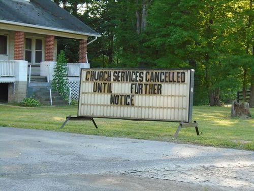 Outside sign that reads "Church services cancelled until further notice"