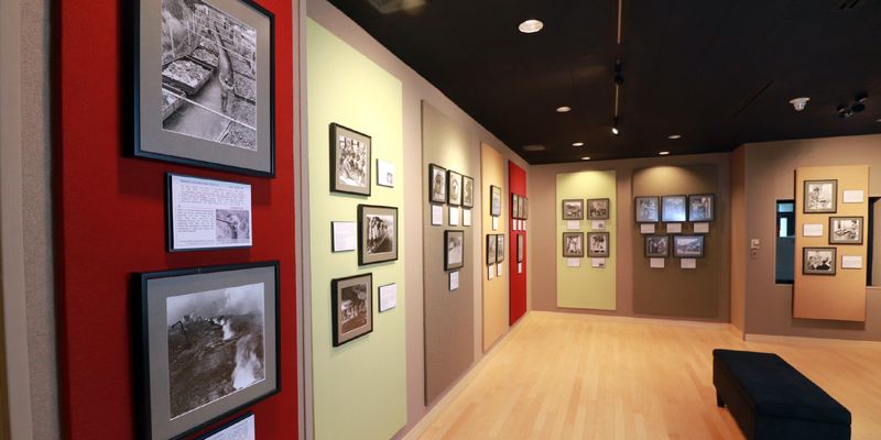 Museum exhibit with photographs on walls